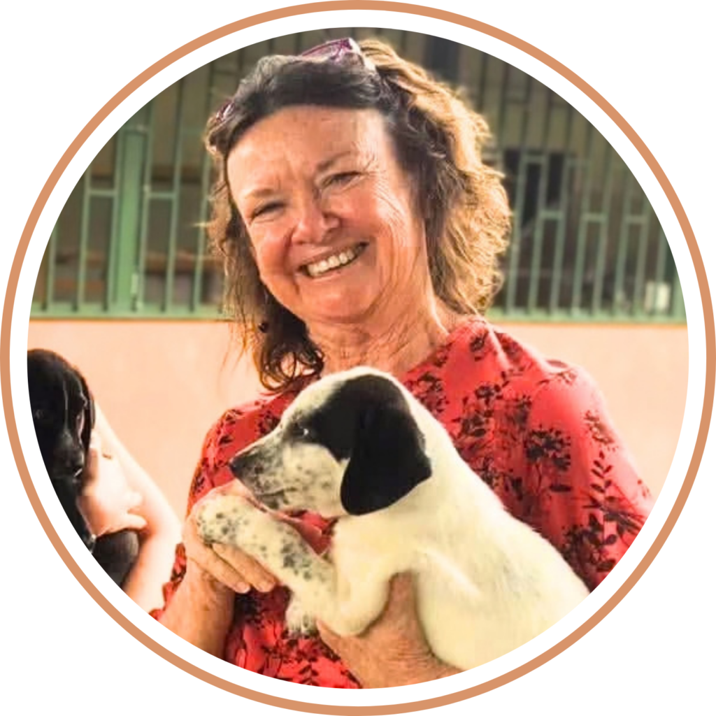 Fundraiser Donna holding white and black puppy